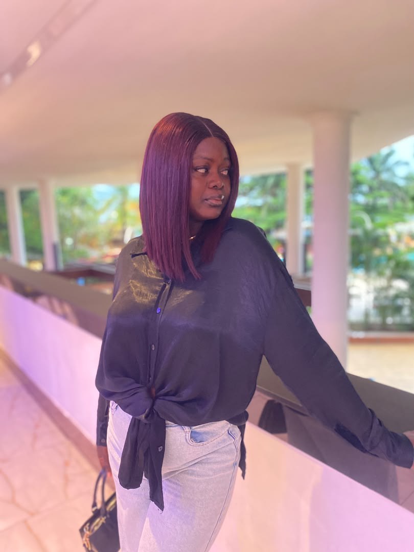A Kinkie’s Place customer wearing a wine-coloured straight bob