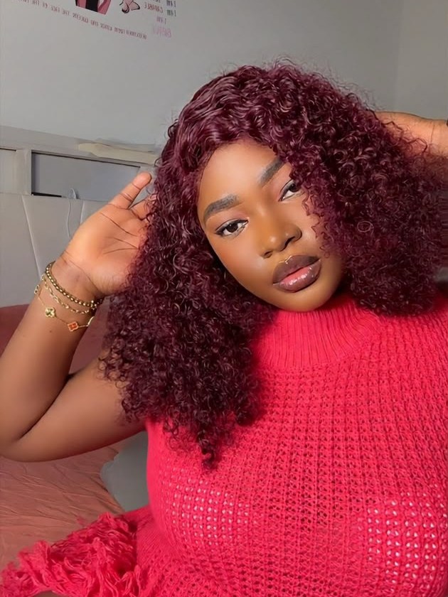 A Kinkie’s Place customer wearing a burgundy curly bob